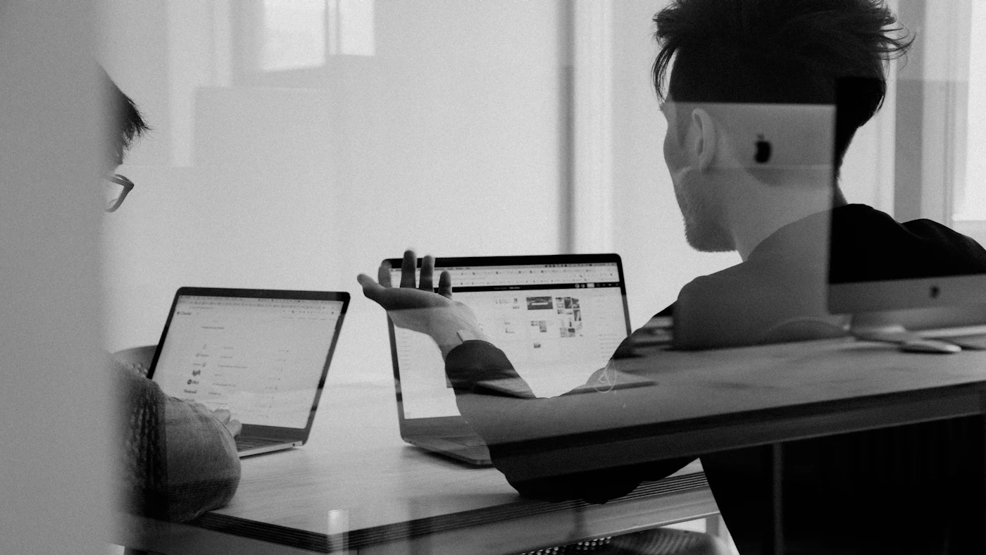 Financial report documents and a calculator on a desk